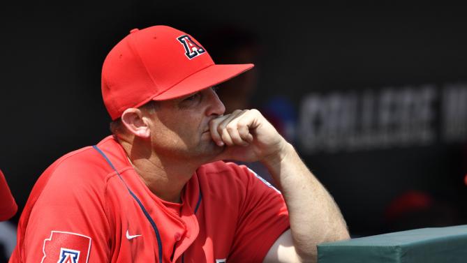 Arizona head coach Jay Johnson watches Coastal Carolina celebrate their 4-3 victory to win the championship after Game 3 of the NCAA College World Series baseball finals in Omaha, Neb., Thursday, June 30, 2016. (AP Photo/Ted Kirk)