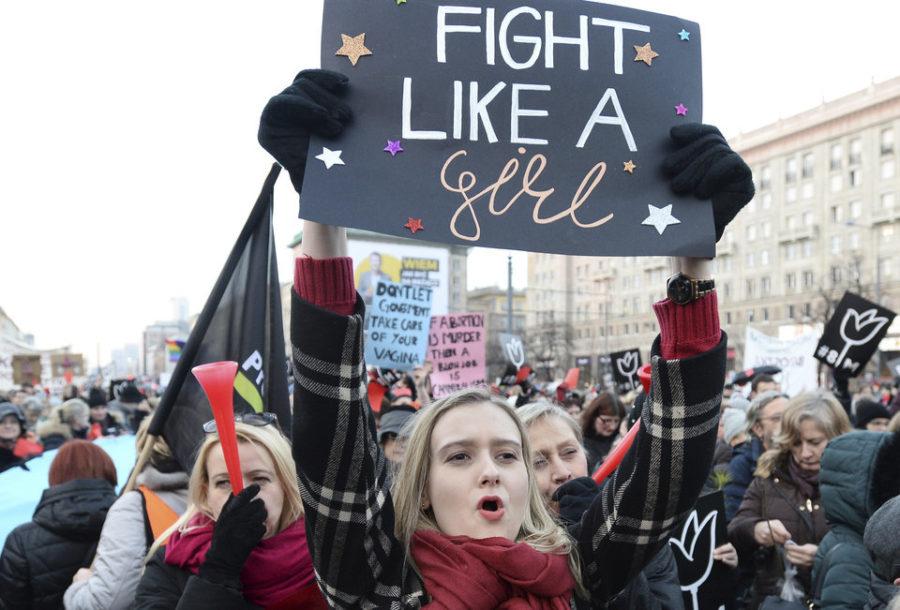 Protesters shout slogans during a nationwide rally on International Women's Day, in Warsaw, Poland, Wednesday, March 8, 2017. Women across Poland are staging rallies and marches to demand protection against violence, equal rights and respect. (AP Photo/Alik Keplicz)