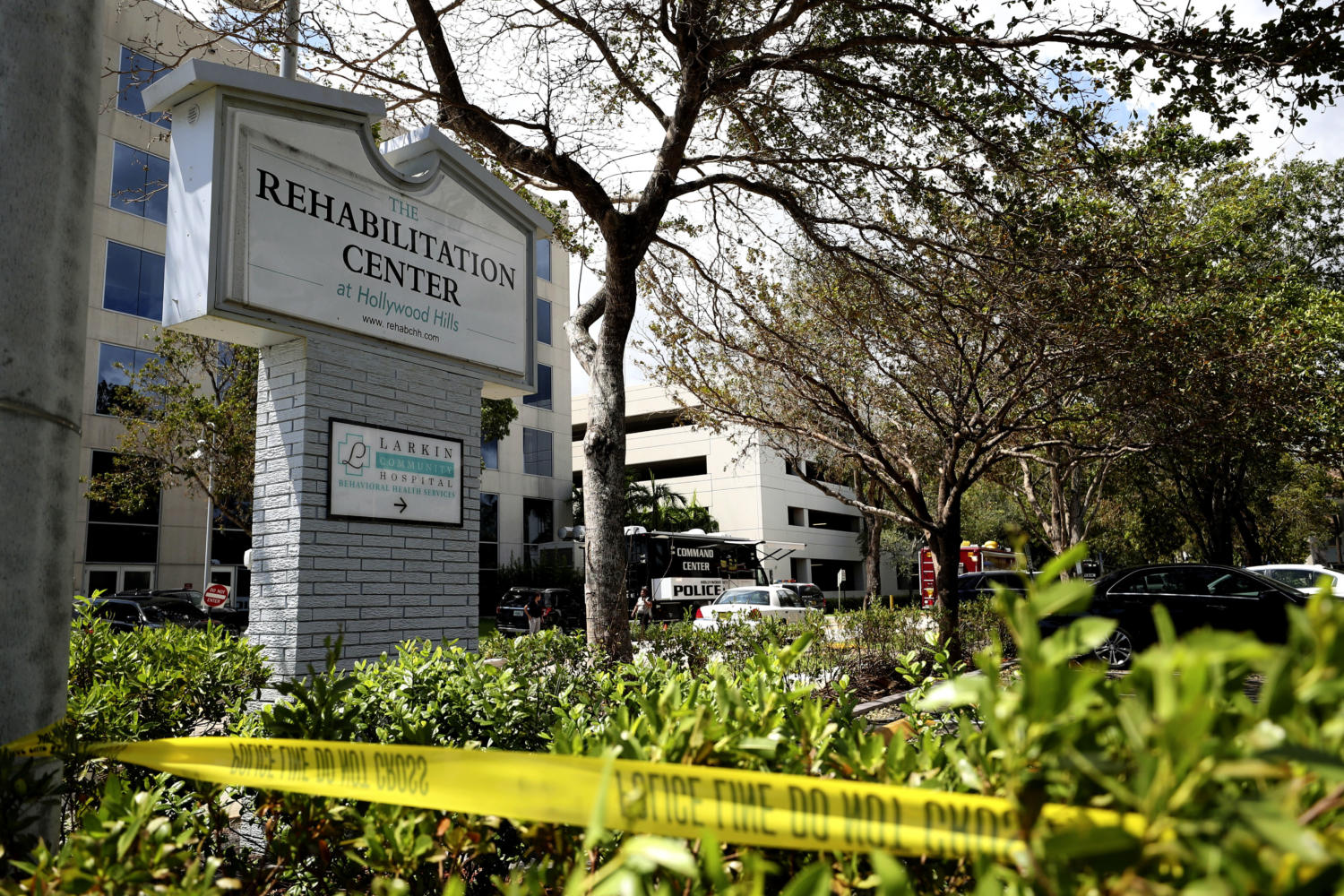 Police surround the Rehabilitation Center in Hollywood Hills, Fla., which had no air conditioning after Hurricane Irma knocked out power, Wednesday, Sept. 13, 2017. Several patients at the sweltering nursing home died in Hurricane Irma's aftermath, raising fears Wednesday about the safety of Florida's 4 million senior citizens amid widespread power outages that could go on for days. (John McCall/South Florida Sun-Sentinel via AP)