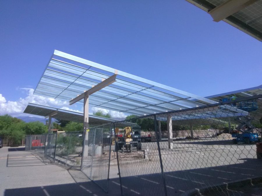 Solar panels being installed in the student parking lot