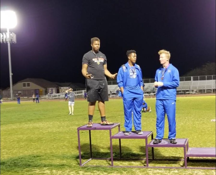 Kingsley (far left) accepting a first place award at Marana Invitational