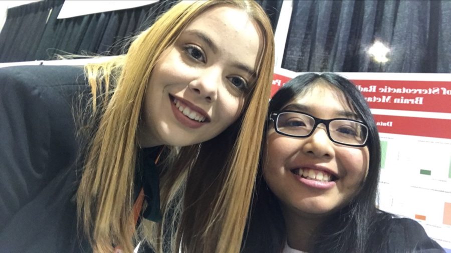 Rachel Porter (left) and Vy Nguyen (right) standing In front of their science project at AzSEF