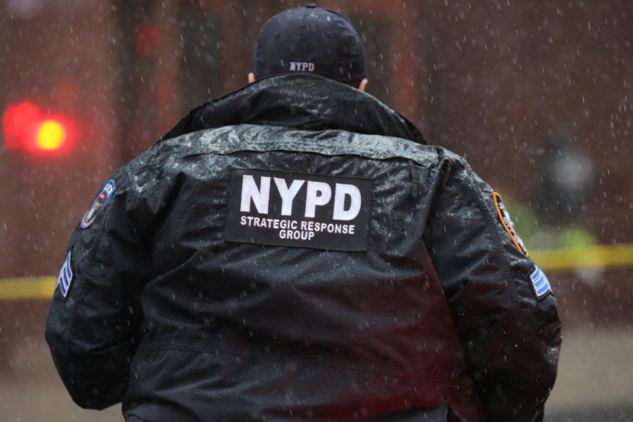 New York City Police Department (NYPD) officer arrives at 787 7th Avenue in midtown Manhattan where a helicopter was reported to have crashed in New York City, New York, U.S., June 10, 2019. REUTERS/Brendan McDermid