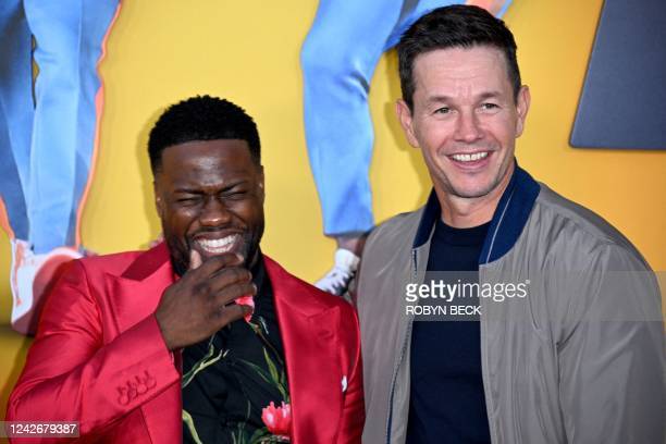 US actor and comedian Kevin Hart (L) and US actor Mark Wahlberg arrive for the premiere of "Me Time" at the Regency Village Theatre in Westwood, Los Angeles, California, on August 23, 2022. (Photo by Robyn Beck / AFP) (Photo by ROBYN BECK/AFP via Getty Images)