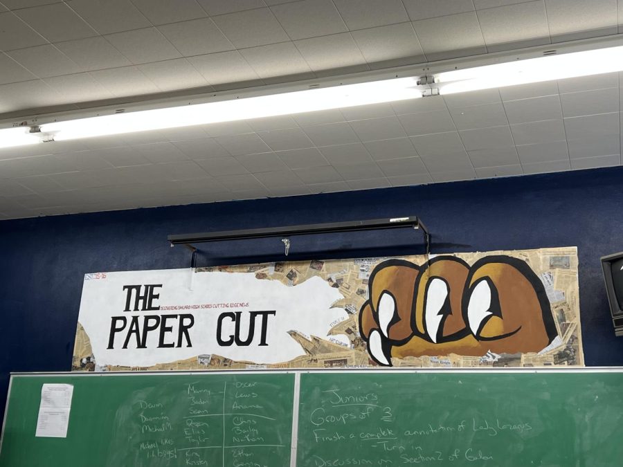 Our "The Paper Cut" sign in the back of the classroom