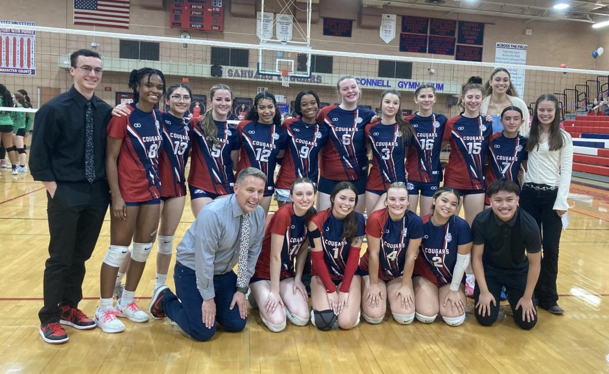 Sahuaro's varsity volleyball team poses for a team picture at senior night  