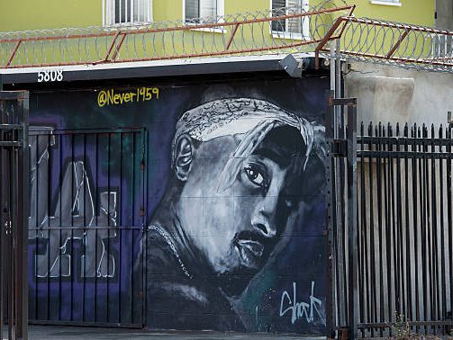 A wall dedicated to the memory of US rapper Tupac Shakur is seen on May 26, 2016 in  Los Angeles, California. 
Twenty years after his death, Tupac still reigns. Other rappers have succeeded him in stardom, and promotional efforts around Tupac have been haphazard, but the artist who died at age 25 on September 13, 1996, in Las Vegas, maintains a hold that is among the most enduring in recent times.  / AFP / VALERIE MACON / TO GO WITH AFP STORY by Shaun TANDON, "20 years on, Tupac reigns as potent global force"        (Photo credit should read VALERIE MACON/AFP via Getty Images)