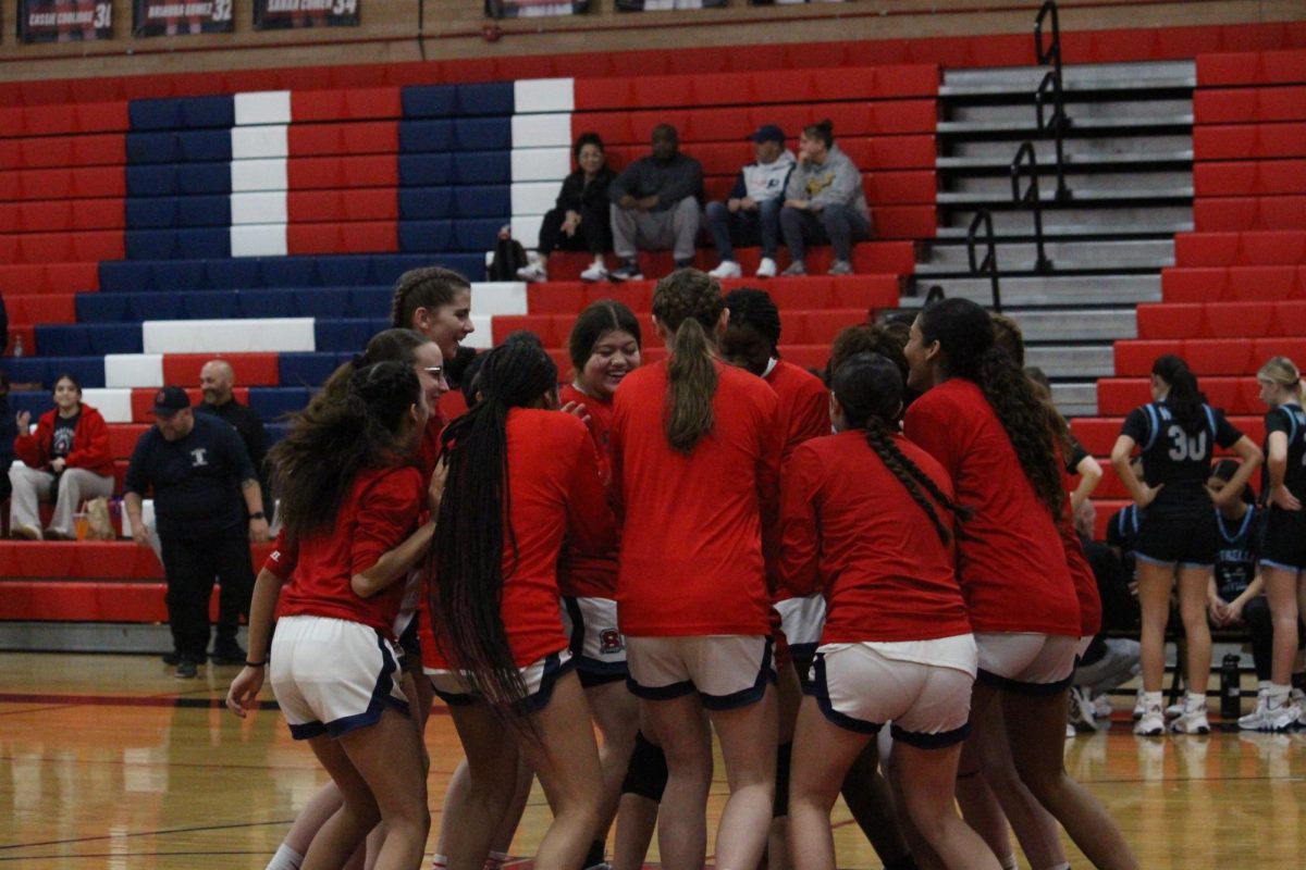 Sahuaro Girls' Varsity Basketball huddles up before their big game