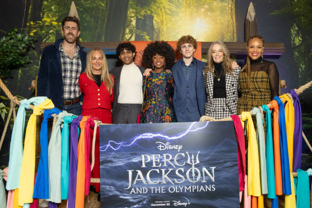 LONDON, ENGLAND - DECEMBER 16: (L to R) Charlie Andrews, Ellen Goldsmith-Vein, Aryan Simhadri, Leah Sava Jeffries, Walker Scobell, Karey Burke and Ayo Davis attend the UK premiere of Disney+ Original series "Percy Jackson And The Olympians" at Odeon Luxe Leicester Square on December 16, 2023 in London, England. (Photo by Shane Anthony Sinclair/Getty Images)