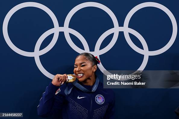 PARIS, FRANCE - JULY 30: Gold medalist Jordan Chiles of Team United States poses with the Olympic Rings during the medal ceremony during the Artistic Gymnastics Women's Team Final on day four of the Olympic Games Paris 2024 at Bercy Arena on July 30, 2024 in Paris, France. (Photo by Naomi Baker/Getty Images)