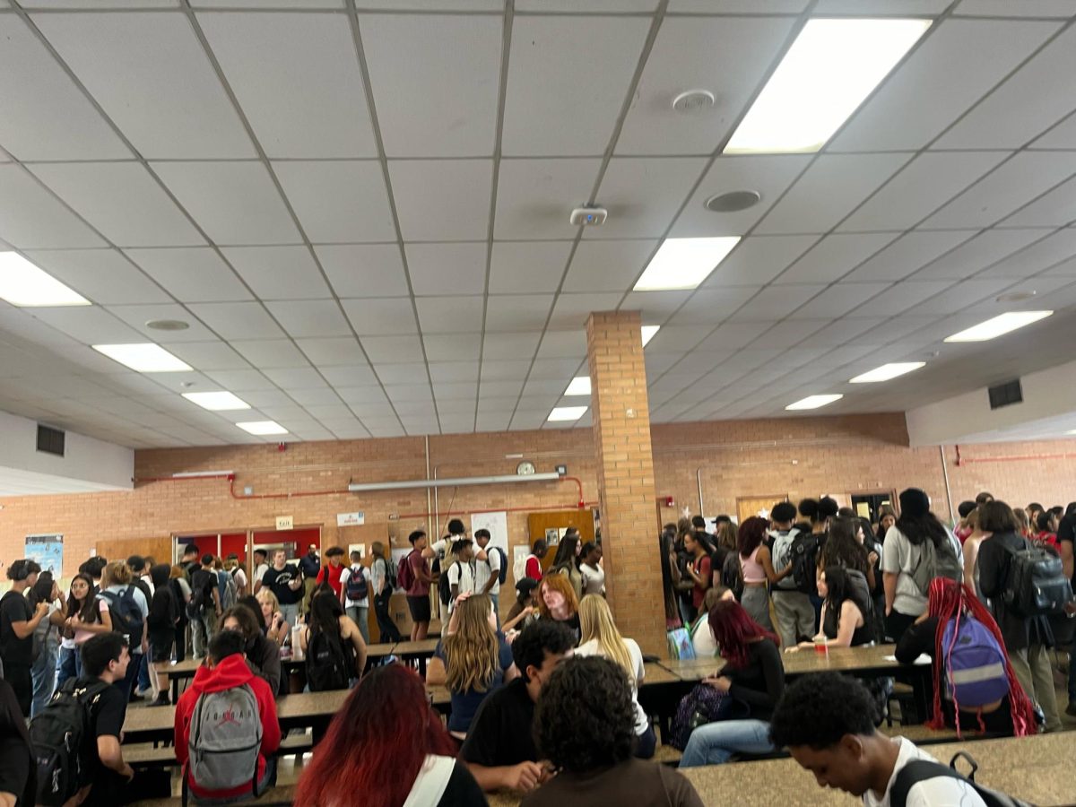 Long lunch lines in the crowded cafeteria 