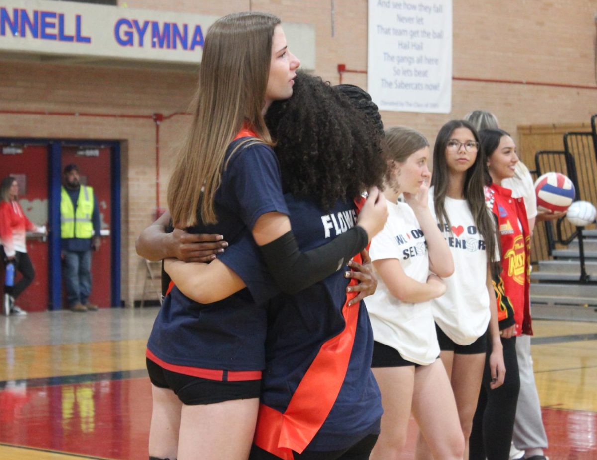 Carly, Montana, and Sirena embrace