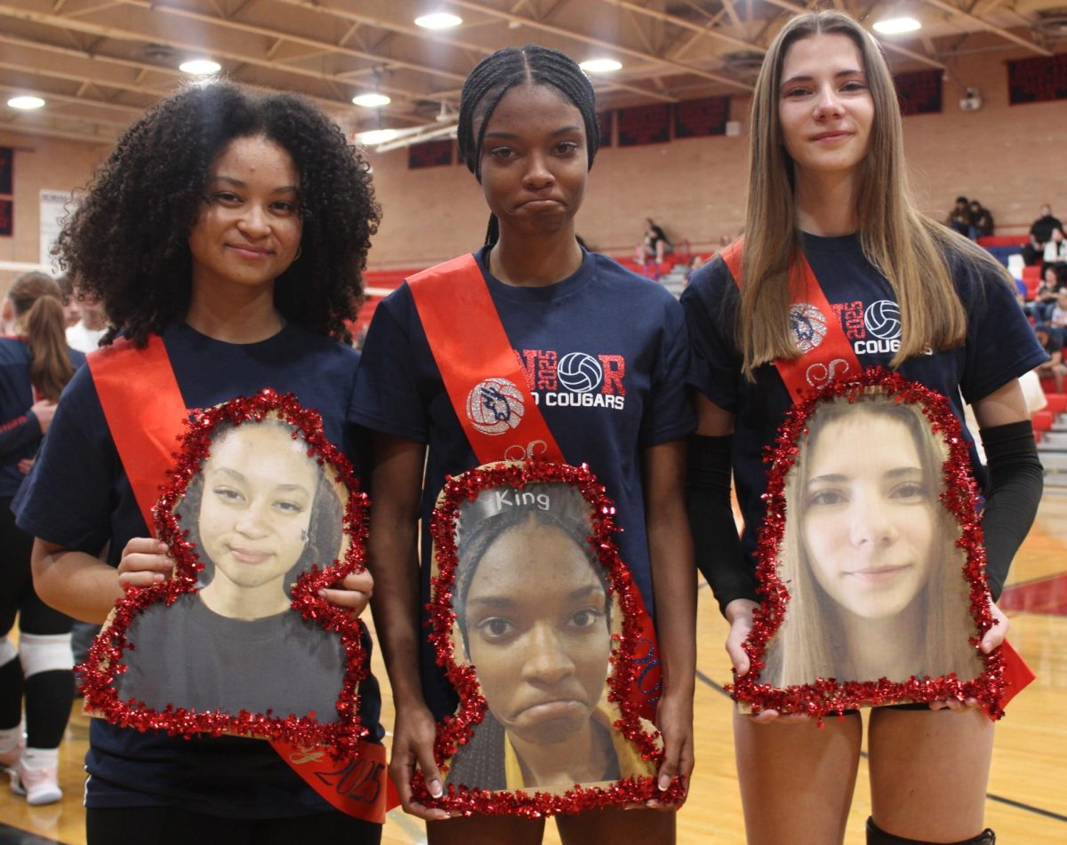 Sirena, Montana, and Carly holding their life-size cardboard heads