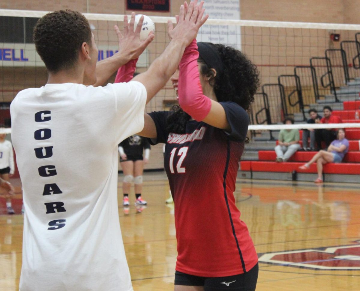 Sergio Flowers and Gianna Buxenbaum high five it out one last time