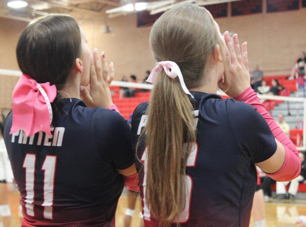 Annebell Patten and Zoeann Plotts shout their support