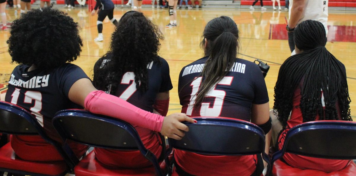 Jade, Gia, Anahi, and Montana cheer on their teammates