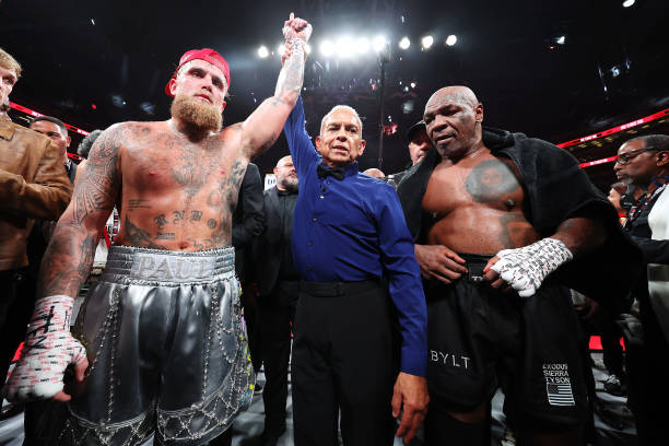 ARLINGTON, TEXAS - NOVEMBER 15: (L-R) Jake Paul announced as winner against Mike Tyson during LIVE On Netflix: Jake Paul vs. Mike Tyson at AT&amp;T Stadium on November 15, 2024 in Arlington, Texas. (Photo by Al Bello/Getty Images for Netflix © 2024)