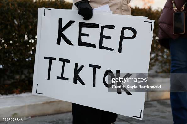 WASHINGTON, DC - JANUARY 10: A TikTok influencer holds a sign that reads "Keep TikTok" outside the U.S. Supreme Court Building as the court hears oral arguments on whether to overturn or delay a law that could lead to a ban of TikTok in the U.S., on January 10, 2025 in Washington, DC. The future of the popular social media plaform is at stake at stake as the Supreme Court hears arguments on a law set to take effect the day before Inauguration Day that would force their China-based parent company to cut ties with TikTok due to national security concerns. (Photo by Kayla Bartkowski/Getty Images)