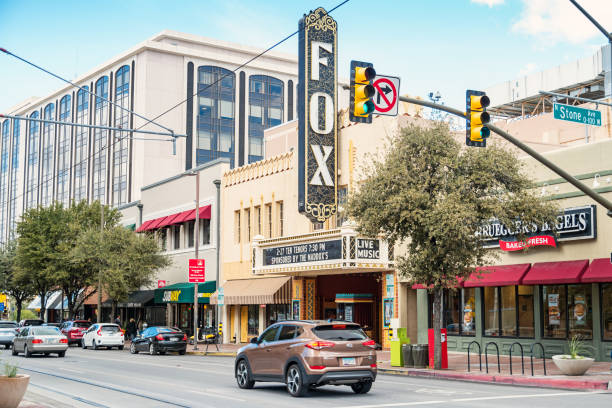 Cars drive past Fox theater in downtown Tucson Arizona USA on a cloudy day.