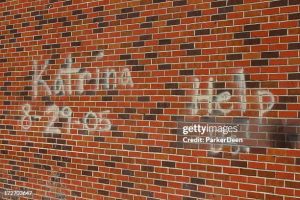 Poignant message spray painted on a wall in Bay Saint Louis, MS Mississippi, 3 weeks following Hurricane Katrina.  Many people were still sleeping on their driveways and were without assistance at this time.