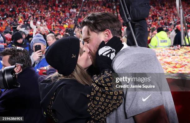 KANSAS CITY, MISSOURI - JANUARY 26: Taylor Swift kisses Travis Kelce #87 of the Kansas City Chiefs after the Chiefs defeated the Buffalo Bills 32-29 to win the AFC Championship Game at GEHA Field at Arrowhead Stadium on January 26, 2025 in Kansas City, Missouri. (Photo by Jamie Squire/Getty Images)