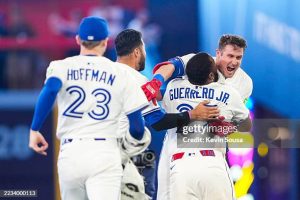 TORONTO, CANADA - SEPTEMBER 9: Tyler Heineman #55 of the Toronto Blue Jays hugs Vladimir Guerrero Jr. #27 after hitting a walk off single against the Houston Astros during the tenth inning in their MLB game at Rogers Centre on September 9, 2025 in Toronto, Canada. (Photo by Kevin Sousa/Getty Images)