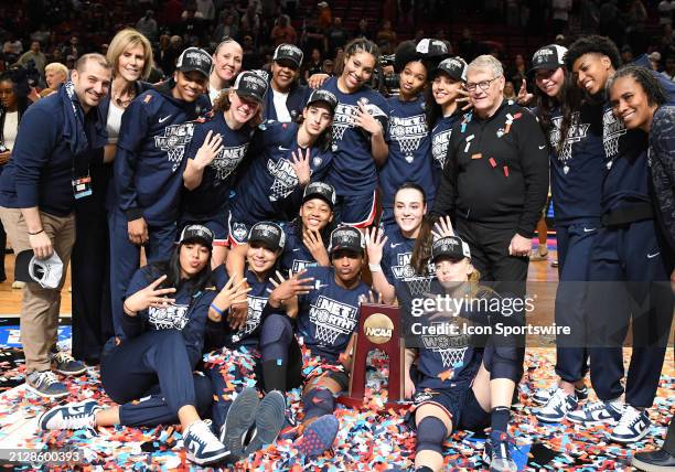 PORTLAND, OR - APRIL 01:  The UConn Huskies celebrate their win during a 2024 Div I Women's Basketball Championship Elite Eight game between the UConn Huskies and USC Trojans on April 1, 2024 at Moda Center in Portland, Oregon. (Photo by Brian Murphy/Icon Sportswire via Getty Images)