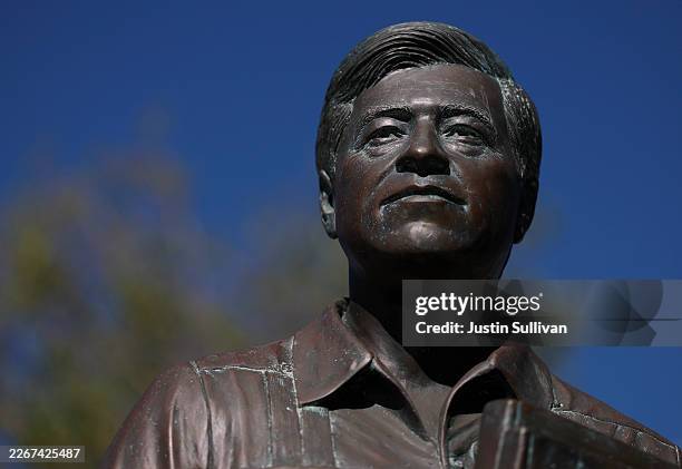 SAN FERNANDO, CALIFORNIA - MARCH 19: A statue of labor leader and civil rights activist Cesar Chavez is seen through a sculpture with the United Farm Workers (UFW) flag at the Cesar E. Chavez Memorial Park on March 19, 2026 in San Fernando, California. A day after mounting calls to reconsider honors for Cesar Chavez amid sexual abuse allegations, California legislative leaders said they would move to rename the March 31 holiday as “Farmworker Day” to reflect the broader labor movement and recognize survivors. (Photo by Justin Sullivan/Getty Images)
